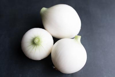 Three onions on a table